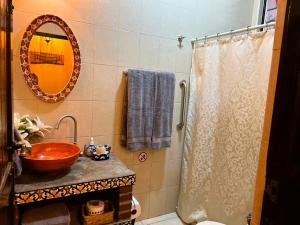 a bathroom with a sink and a shower at Casa Punta Perula VILLAS in Pérula +26 photos