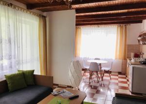 a living room with a couch and a table at Ryn Lake Resort 2 in Ryn