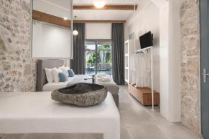 a bathroom with a sink in the middle of a room at Agorastos Luxury Living in Platamonas