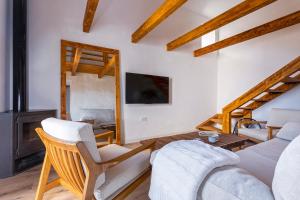 a living room with a couch and a fireplace at Campo and relax Málaga country house in Málaga