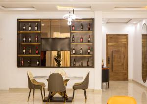 a dining room with a display of wine bottles at Super Star Midak Mews 2 in Lekki