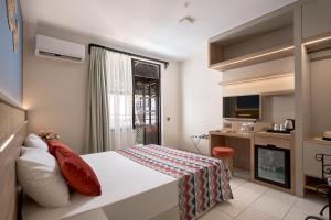 a bedroom with a bed and a kitchen at Club Titan Hotel Ultra All Inclusive in Kargicak +65 photos