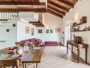 a living room with a table and a couch at Apartment Laghina by Interhome in Musso