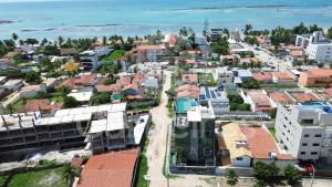 an aerial view of a city with buildings at Makani Beach Campas - Praia de Tamandaré in Tamandaré