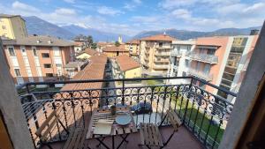 a balcony with a view of a city with buildings at Casa Tatta - Luino centro in Luino