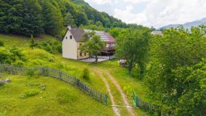 an aerial view of a house on a hill at Hotel Shen Klementi in Vermosh