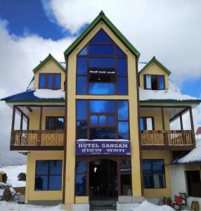 a building with a sign on the front of it at Hotel sangam kalinchok kuri in Dolakhā