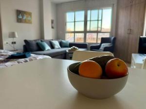 a bowl of fruit on a table in a living room at Aguas Salinas A3 Studio in San Pedro del Pinatar