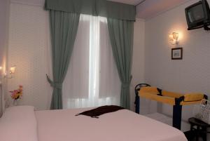 Ένα ή περισσότερα κρεβάτια σε δωμάτιο στο Hotel Loreley