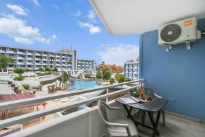 a balcony with a table and a view of a city at GOLF Villa233 in San Miguel de Abona +6 photos