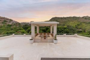 a gazebo on the roof of a house at Emerald Hill Villa by Jodhani in Udaipur
