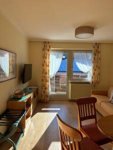a living room with a couch and a table at Residence Intica in San Candido