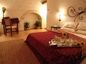 Letto o letti in una camera di Hotel Masseria Fortificata Donnaloia