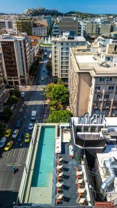 an overhead view of a city with a pool and buildings at VISION Omonia Athens in Athens