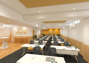 a rendering of a dining room with tables and chairs at Bloom Hotel Chennai Central in Chennai +15 photos