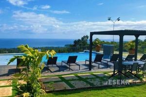 a villa with a view of the ocean at ESEKK Ochi in Ocho Rios