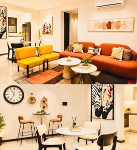 a living room with a couch and chairs and tables at Platinum apartments in Gaborone