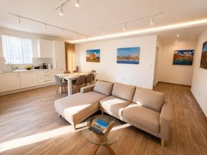 a living room with a couch and a table at Il Kenn ta Zeppi - Apartment 4 in Qala