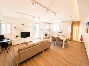 a living room with a couch and a table at Il Kenn ta Zeppi - Apartment 4 in Qala