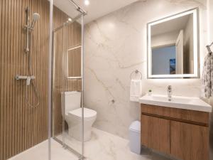 a bathroom with a toilet and a sink and a shower at Il Kenn ta Zeppi - Apartment 4 in Qala +17 photos