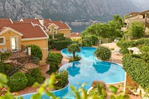 a swimming pool in front of a house at GH Mountain & Bay View with POOL in Gornji Orahovac