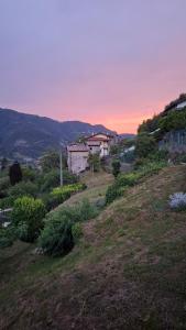 a view of a hill with a house on it at Casa Lilli in Zogno