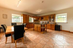 a large kitchen with a table and a dining room at Stone House , Boyne Valley Views in Donore