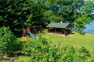 a park with a playground and a gazebo at Agroturystyka Nad Hańcza in Błaskowizna