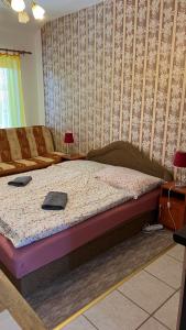 a bedroom with a bed in a room at Adria penzión in Štúrovo +87 photos