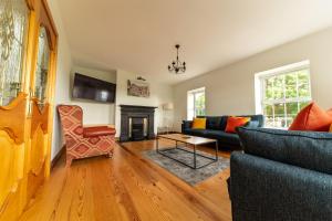 a living room with a couch and a fireplace at Stone House , Boyne Valley Views in Donore