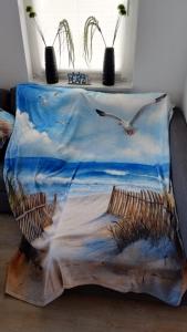 a table with two seagulls flying over the ocean at Ferienhaus Happytime in Binz
