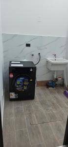 a bathroom with a toilet and a sink at Pimentel Casa in Chiclayo