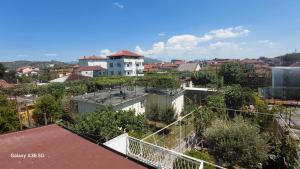 a view of a city with a white building at Vila Nela in Shkodër