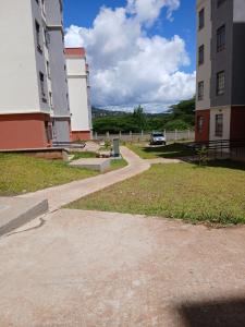a walkway in front of a building with a car at Machakos Town Studios in Machakos
