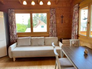 a living room with a couch and a table at Blockhaus Nikolaus in Güssing