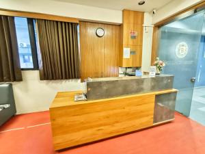 an office with a reception desk in a building at Hotel Royal Relax in Gandhinagar