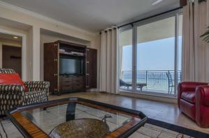 a living room with a view of the ocean at Three Bedroom Corner Condo with Gulf View Balcony in Pensacola