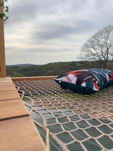 a pair of pillows sitting on top of a roof at Le dôme de Clem in Figeac