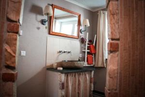a bathroom with a sink and a mirror at Ferienwohnung WohlFühlWohn in Vreden +53 photos