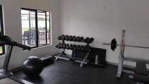 a room with a gym with weights at Muzhi Wetu Lodge in Chanamo