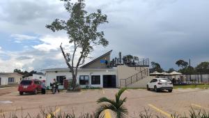 a building with cars parked in front of it at Muzhi Wetu Lodge in Chanamo