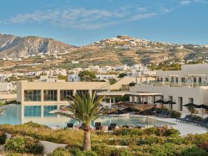 a view of a building with a resort at Noūs Santorini, a Member of Design Hotels in Mesaria