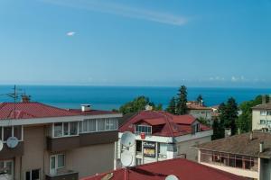 a group of buildings with the ocean in the background at The MU City Hotel Trabzon in Trabzon
