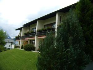 a house with a balcony with plants on it at Haus Barrett by MoniCare in Seefeld in Tirol