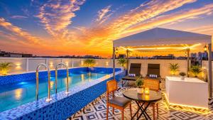 a balcony with a pool on top of a building at HOTEL GREEN VEGAS in New Delhi