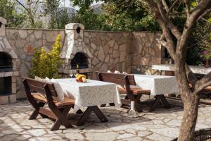 a table with two chairs and a table with a table cloth at Step to Kotor bay St-oliv in Kotor