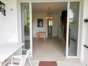 a hallway of a house with a table and chairs at Villa Duna Verde in Duna Verde +58 photos