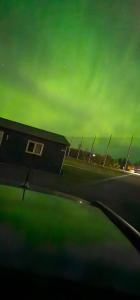 a view of the wing of an airplane with a green sky at A magical get away experience in Matlock +2 photos