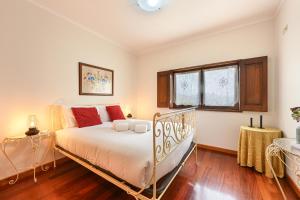 a bedroom with a bed and a window at Casa da Galheira with Swimming Pool by Sé Apartamentos in Vilela +19 photos