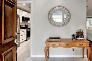 a kitchen with a table and a mirror on the wall at 106 Shore Rush Trail in Blackbanks +22 photos